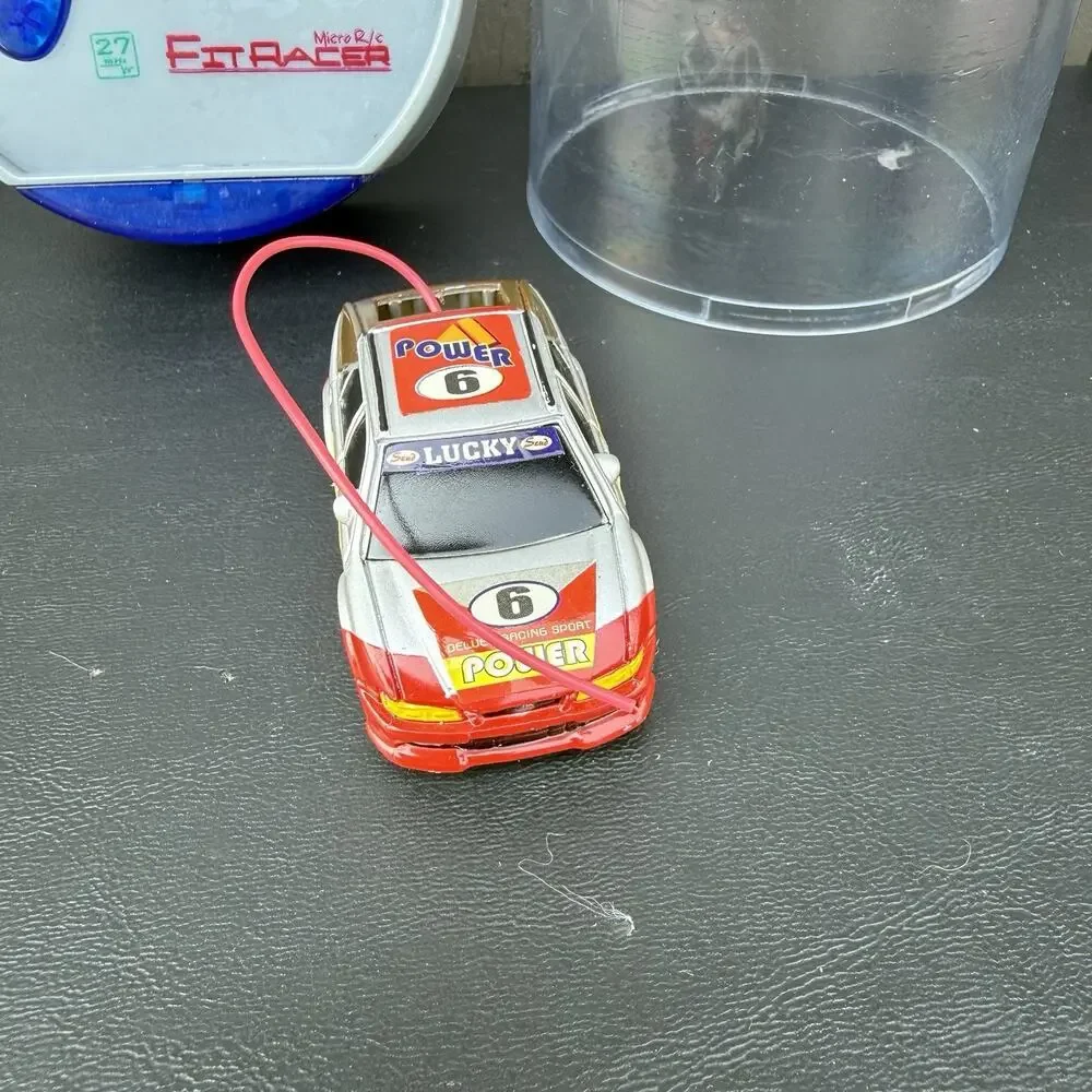 Vintage Remote Controlled Micro Car Mini Master racer. Charges And Works
